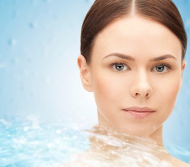 face of beautiful young woman and water splash clipart