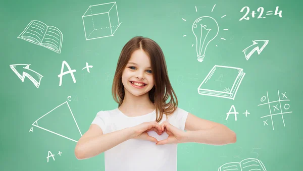 Smiling little girl in white blank t-shirt — Stock Photo, Image