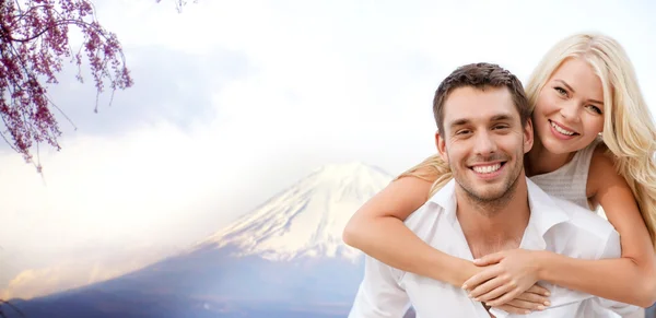 Couple having fun  over fuji mountain in japan — Stock Photo, Image