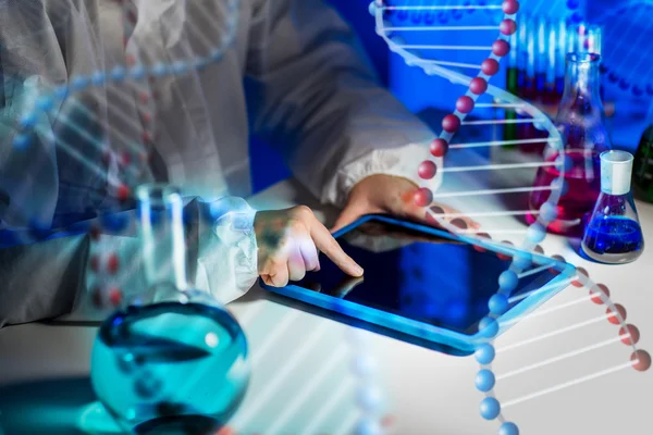 Close up of scientist with tablet pc in laboratory — Stock Photo, Image