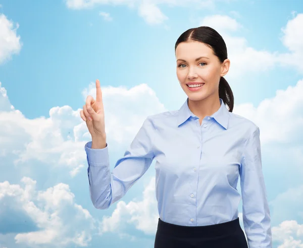 Businesswoman touching something imaginary — Stock Photo, Image