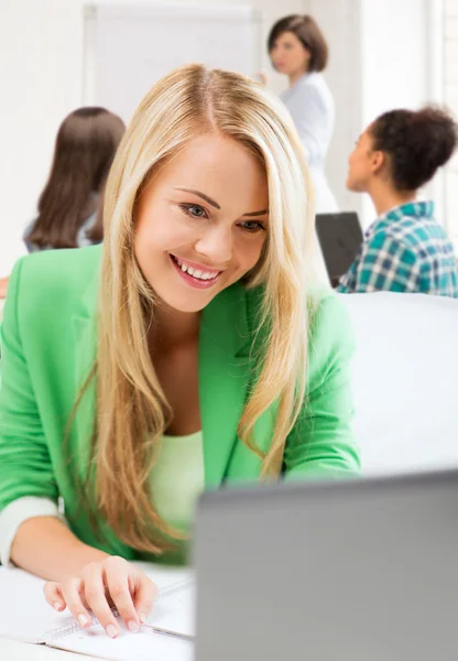 Student girl with laptop in college — Stock Photo, Image