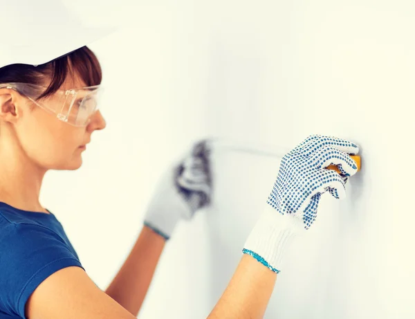 Architect measuring wall with flexible ruller — Stock Photo, Image