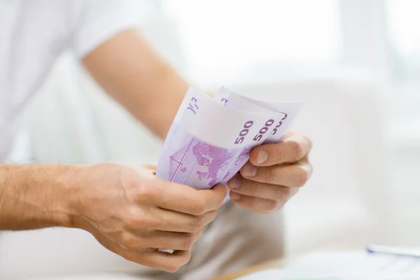 Close up of man hands counting money at home — Stock Photo, Image