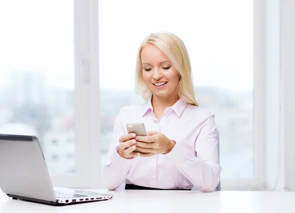 smiling businesswoman or student with smartphone