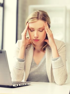 tired woman with laptop computer clipart