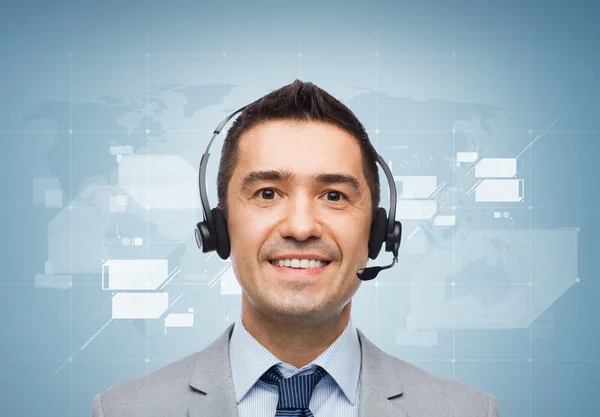 Smiling businessman in headset — Stock Photo, Image