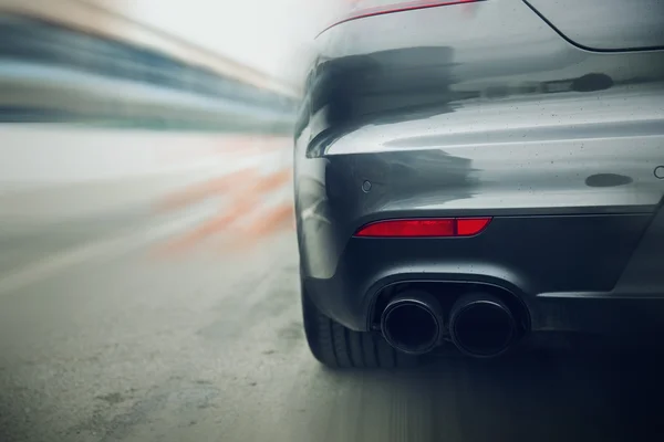 Close up of car riding on highway from back — Stock Photo, Image