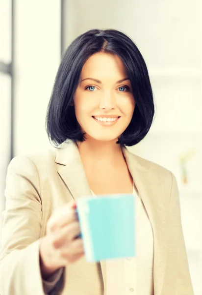 Lovely businesswoman with mug — Stock Photo, Image