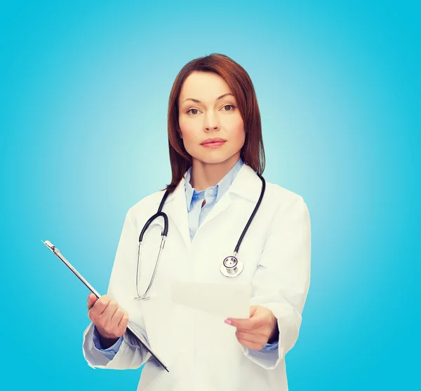 Calm female doctor with clipboard — Stock Photo, Image