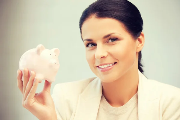 Mooie vrouw met piggy bank — Stockfoto