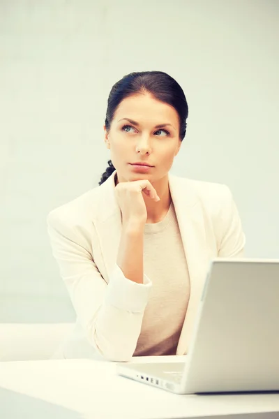 Pensive woman with laptop computer — Stock Photo, Image