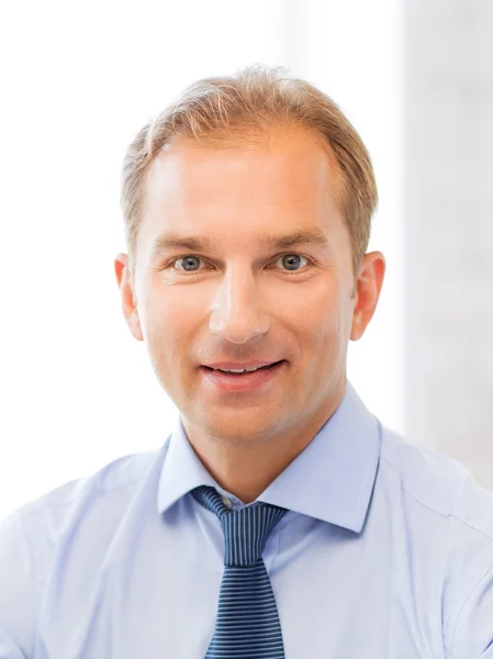 Smiling businessman in office — Stock Photo, Image