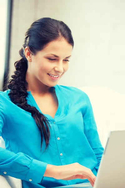 Happy woman with laptop computer Stock Image