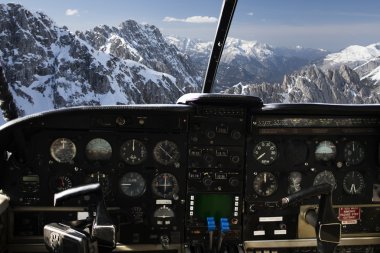 dashboard in airplane cockpit and mountains view clipart