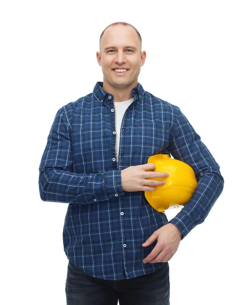 Glimlachende man in helm met handschoenen — Stockfoto