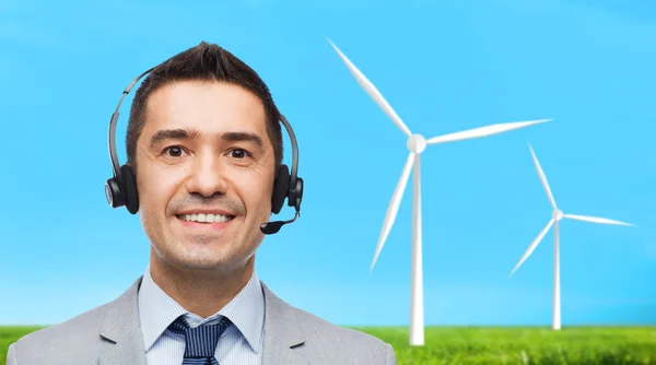 Smiling businessman in headset — Stock Photo, Image