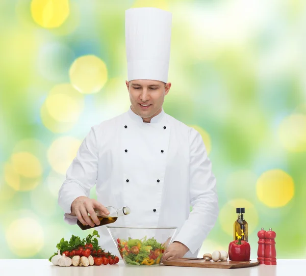 Happy male chef cook cooking food — Stock Photo, Image