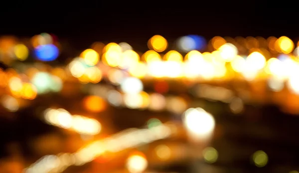 Goldene helle Lichter auf dunklem Nachthintergrund — Stockfoto