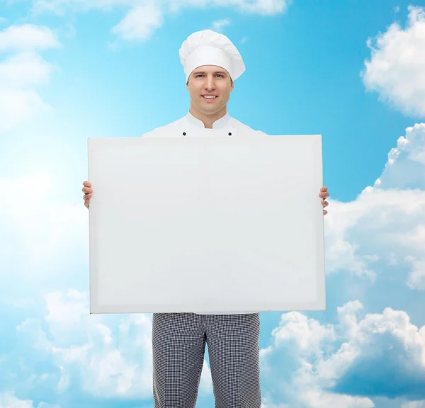 Zadowolony mężczyzna kucharz trzyma biały duża deska — Zdjęcie stockowe