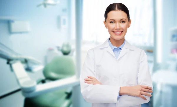 Happy young female dentist with tools — Stock Photo, Image