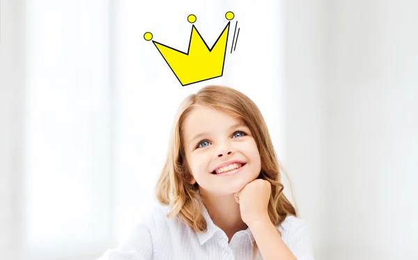 Smiling little school girl with crown — Stock Photo, Image