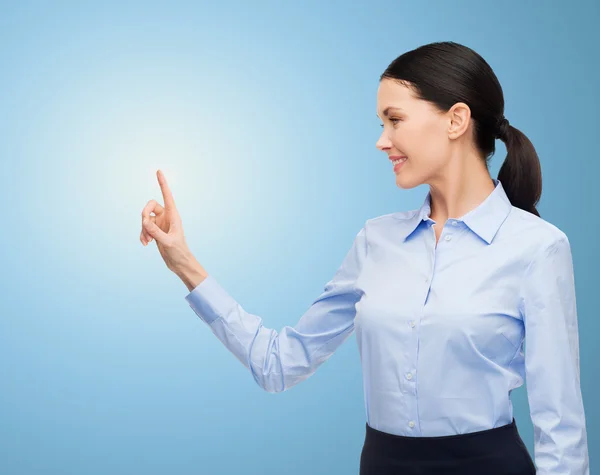 Businesswoman touching something imaginary — Stock Photo, Image