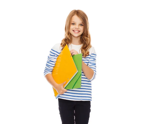 Criança segurando pastas coloridas — Fotografia de Stock