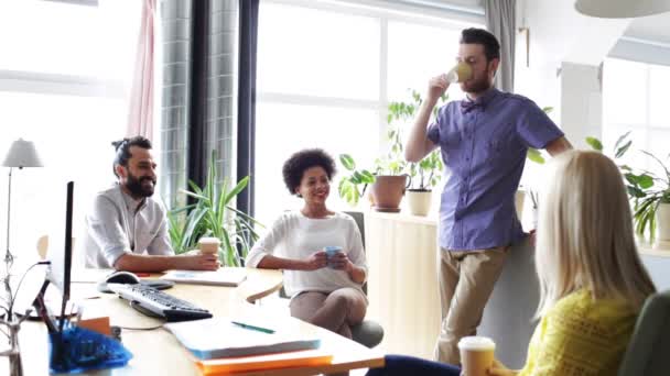 Happy creative team drinking coffee in office — Stock Video