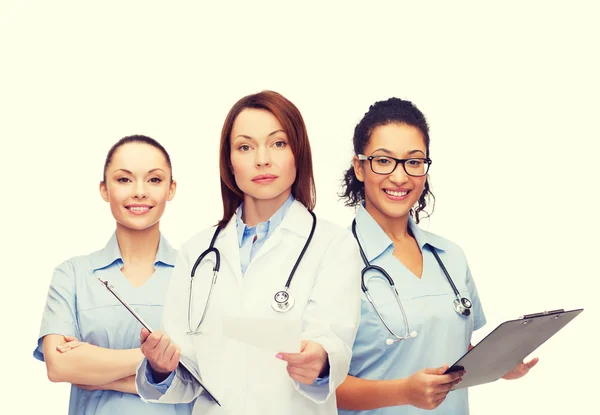 Calm female doctor with clipboard — Stock Photo, Image