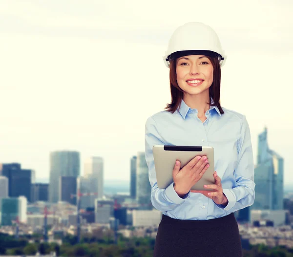 Young smiling businesswoman in white helmet — Stock Photo, Image