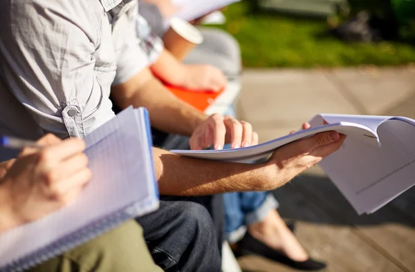 Close up of students with notebooks at campus — Stock Photo, Image