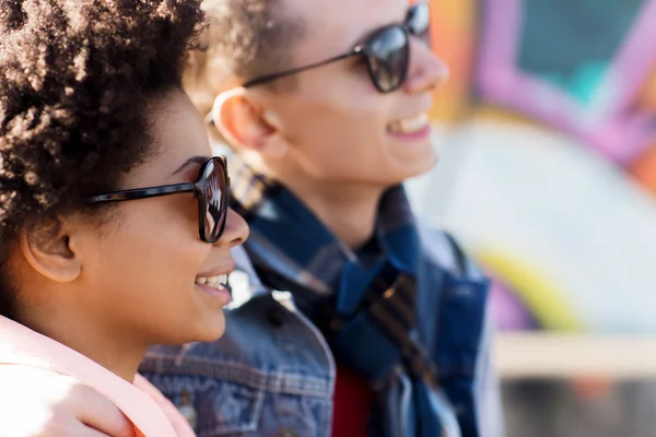 Happy teenage friends in shades outdoors — Stock Photo, Image