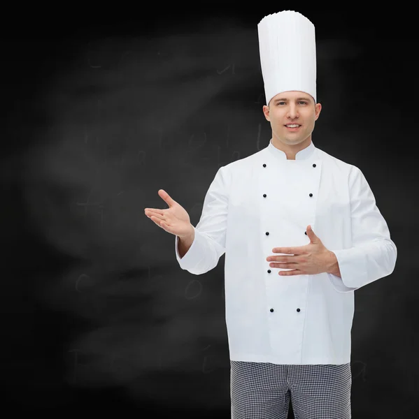 Happy male chef cook inviting — Stock Photo, Image