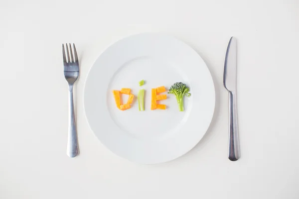 Închiderea plăcii cu litere dietetice vegetale — Fotografie, imagine de stoc