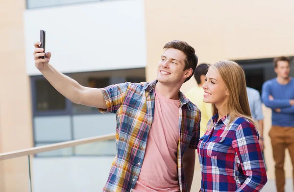 Group of smiling students outdoors — Stock Photo, Image