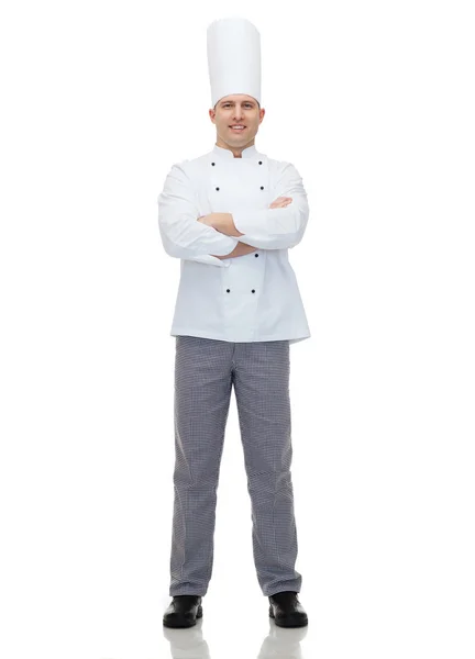 Heureux cuisinier chef masculin avec les mains croisées — Photo