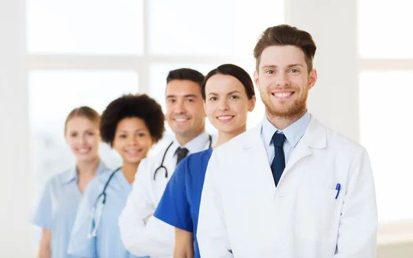 Group of happy doctors at hospital — Stock Photo, Image