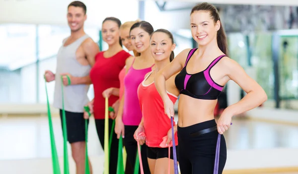 Group of people working out with rubber bands — Stock Photo, Image