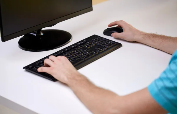 Close up of male hands with computer and keyboard — Stock Photo, Image