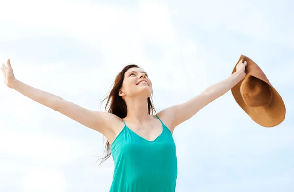 Girl with hands up on the beach — Stock Photo, Image