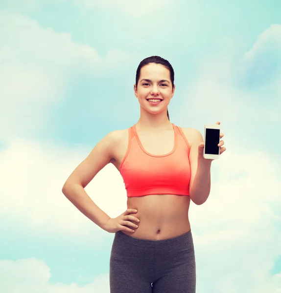 Sporty woman with smartphone — Stock Photo, Image