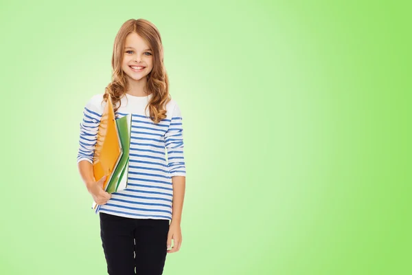 Happy girl holding colorful folders — Stock Photo, Image