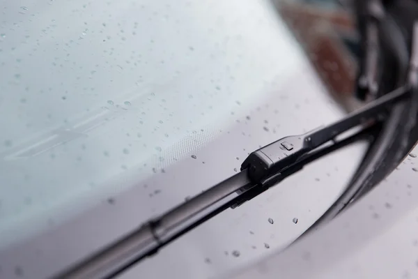 Close up of windshield wiper and wet car glass — Stock Photo, Image