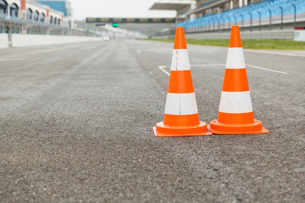 Traffic cones on speedway of stadium — Stock Photo, Image
