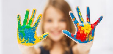 girl showing painted hands clipart
