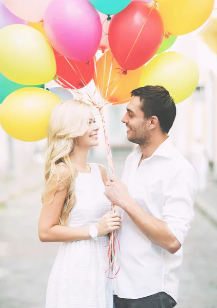 Couple with colorful balloons — Stock Photo, Image