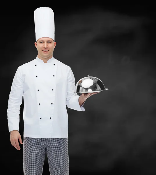 Happy male chef cook holding cloche — Stock Photo, Image