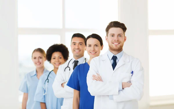 Group of happy doctors at hospital — Stock Photo, Image