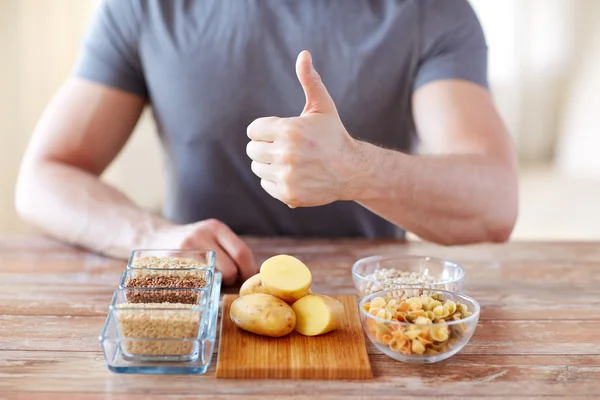 close up of male hands with carbohydrate food